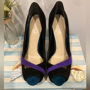 Guess Isila peep-toe high heels in black, purple, and teal suede